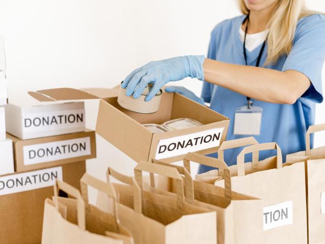 person-preparing-food-bags-donation.jpeg (1)