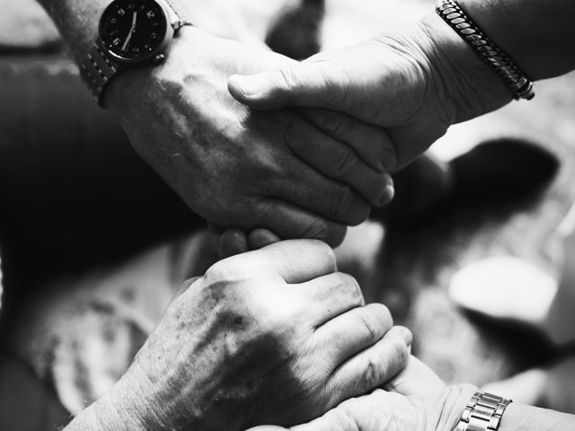 senior-couple-holding-hands-together.jpeg
